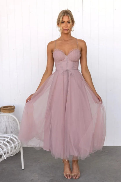 Pink - Rust brown tulle midi dress featuring a structured corset bodice with ruched cups, thin straps, a delicate waist tie, and a voluminous A-line skirt with a sheer hem.
