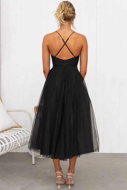 Pink - Rust brown tulle midi dress featuring a structured corset bodice with ruched cups, thin straps, a delicate waist tie, and a voluminous A-line skirt with a sheer hem.